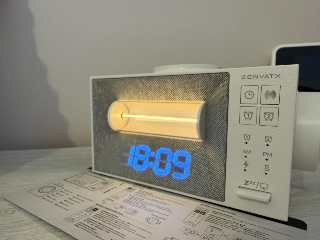 Bedside sound machine with alarm clock and warm nightlight